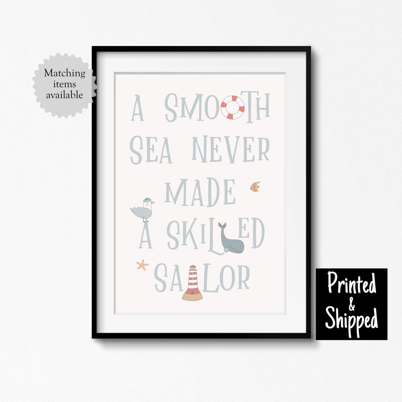 May include: A nautical themed printable wall art print with the quote "A smooth sea never made a skilled sailor" in blue text with illustrations of a seagull, a whale, a lighthouse, a fish, and a life preserver.