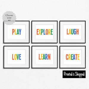 May include: Six framed prints with colorful text on a white background. The words are "PLAY", "EXPLORE", "LAUGH", "LOVE", "LEARN", and "CREATE".