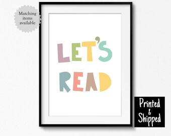 May include: A colourful printable wall art print with the text "Let's Read" in a playful font. The letters are in different colours, including pink, green, yellow, and blue.