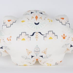 Pillow fabric cloud patterned original Aztec and colored on white background.