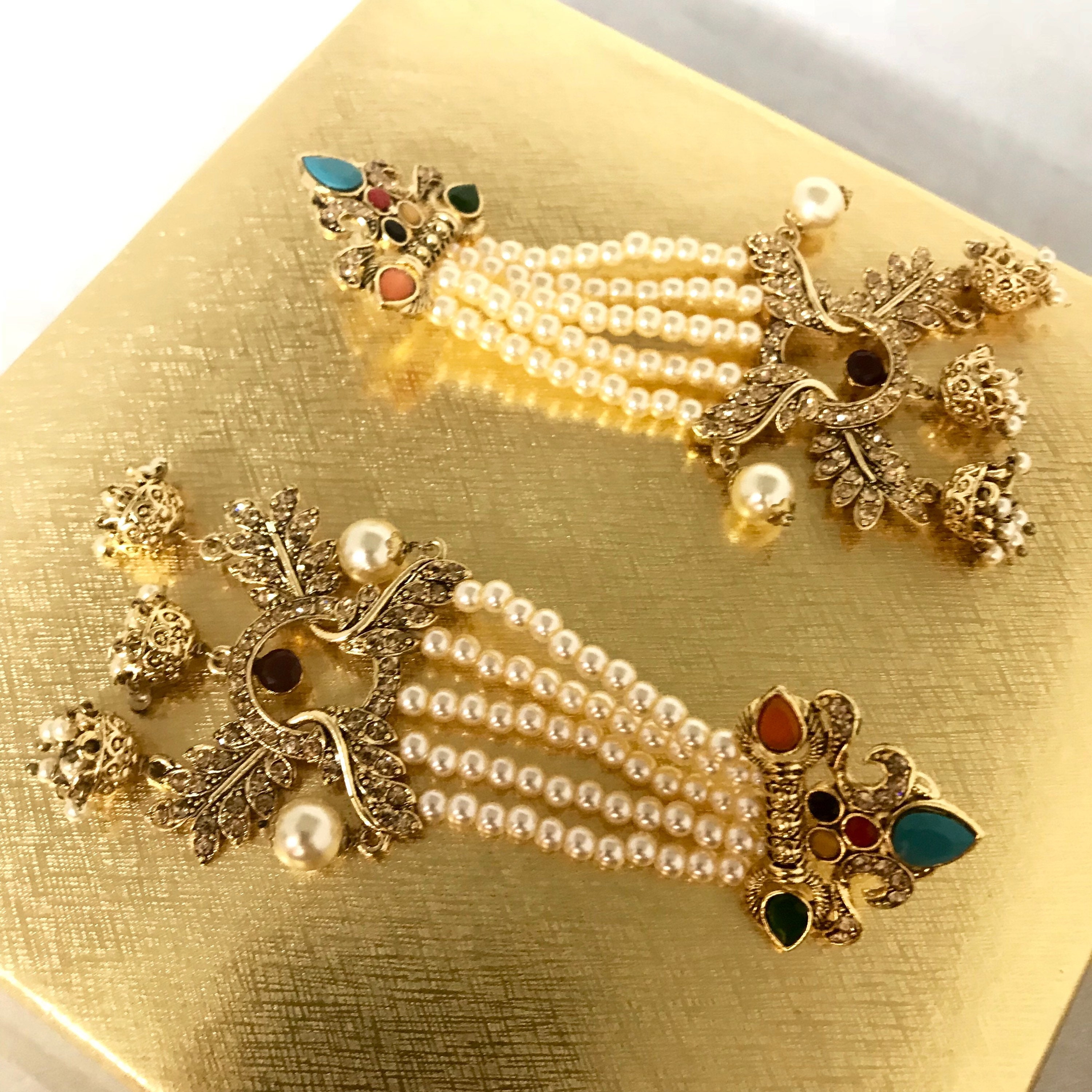 Radha Gold zirconia multi colour 3 jhumka pearl strand earrings