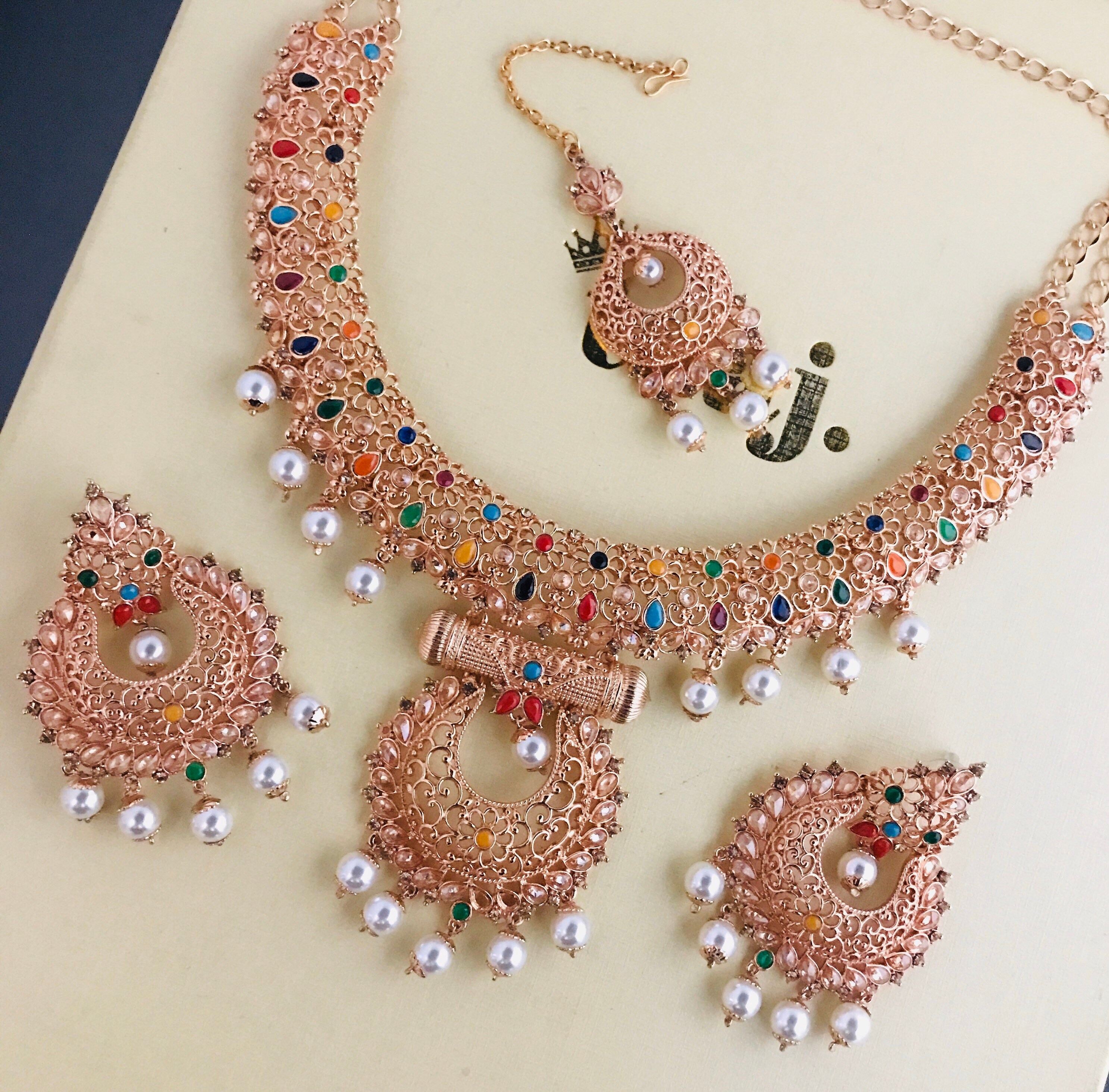 Taiba Rose gold multi colour necklace earrings tikka set