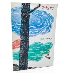 May include: Vintage book cover titled "The Big Sky" with a stylized illustration. The cover features a dark tree trunk, blue and green clouds, and a small sailboat. The author's name, A.B. Guthrie, Jr., is also visible.