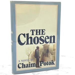 May include: A vintage hardcover book titled "The Chosen" by Chaim Potok. The cover features an illustration of two men walking up a set of stairs.