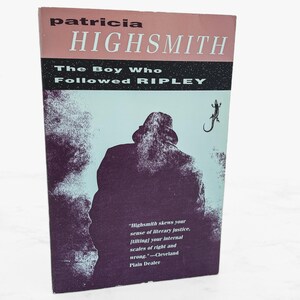 May include: A vintage paperback book titled "The Boy Who Followed Ripley" by Patricia Highsmith. The cover features a silhouette of a person in a hat and coat, with a lizard illustration. The book has a pink and black color scheme.