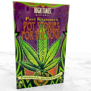 May include: A book titled "Pot Stories for the Soul" by Paul Krassner, presented by High Times. The cover features a large green cannabis leaf on a black and green background with purple accents. The foreword is by Harlan Ellison.
