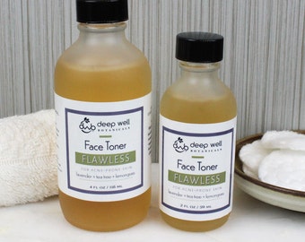May include: Two glass bottles of face toner labeled "Deep Well Botanicals Face Toner Flawless" for acne-prone skin. The smaller bottle is 2 fl oz and the larger bottle is 4 fl oz.
