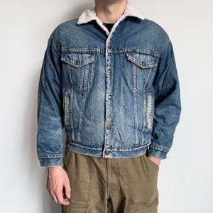 levis sherpa jacket, vintage 80s 1980s Levis Type 3 faded worn repaired blue stonewashed denim pile trucker jacket, size M / L
