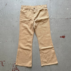 70s vintage Levis beige bell bottom flare cut hippie pants trousers brass scovill zipper made in USA fits like W30 lot
