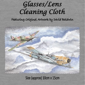 May include: A cleaning cloth featuring original artwork of two airplanes in the sky. The cloth is 10 inches by 15 inches. The artwork is by David Baldwin.