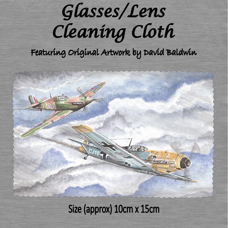 May include: A cleaning cloth featuring original artwork of two airplanes in the sky. The cloth is 10 inches by 15 inches. The artwork is by David Baldwin.