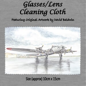 May include: A gray and white watercolor illustration of a vintage airplane on a cleaning cloth. The cloth is designed for cleaning glasses and lenses. The cloth measures approximately 10 inches by 15 inches.