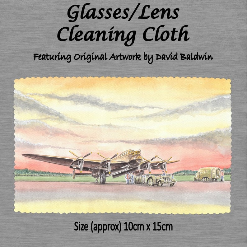 May include: A glasses cleaning cloth featuring a watercolor painting of a vintage airplane against a sunset sky. The cloth is approximately 10 inches by 15 inches.