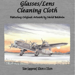 May include: A cleaning cloth featuring an original watercolor illustration of a vintage airplane against a sunset sky. The cloth is approximately 10 inches by 15 inches.