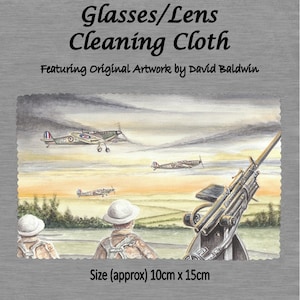 May include: A microfiber cleaning cloth featuring an original watercolor painting of a World War II scene. The painting depicts three British fighter planes flying over a field with a gun emplacement in the foreground. The text "Glasses/Lens Cleaning Cloth" and "Featuring Original Artwork by David Baldwin" is printed on the cloth. The cloth measures approximately 10 cm by 15 cm.