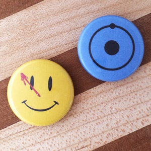 Dr. Manhattan and The Comedian Watchmen Button Set