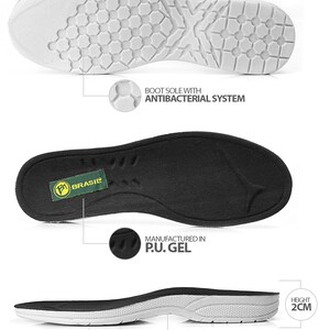 Puede incluir: Primer plano de la suela de un zapato que muestra las siguientes caracter&iacute;sticas: una plantilla negra con la palabra "BRASIL" en verde, una suela exterior blanca con un patr&oacute;n de panal y una suela intermedia blanca con el texto "BOOT SOLE WITH ANTIBACTERIAL SYSTEM", "MANUFACTURED IN P.U. GEL", "SHOCK ABSORPTION SYSTEM" y "HEIGHT 2CM".