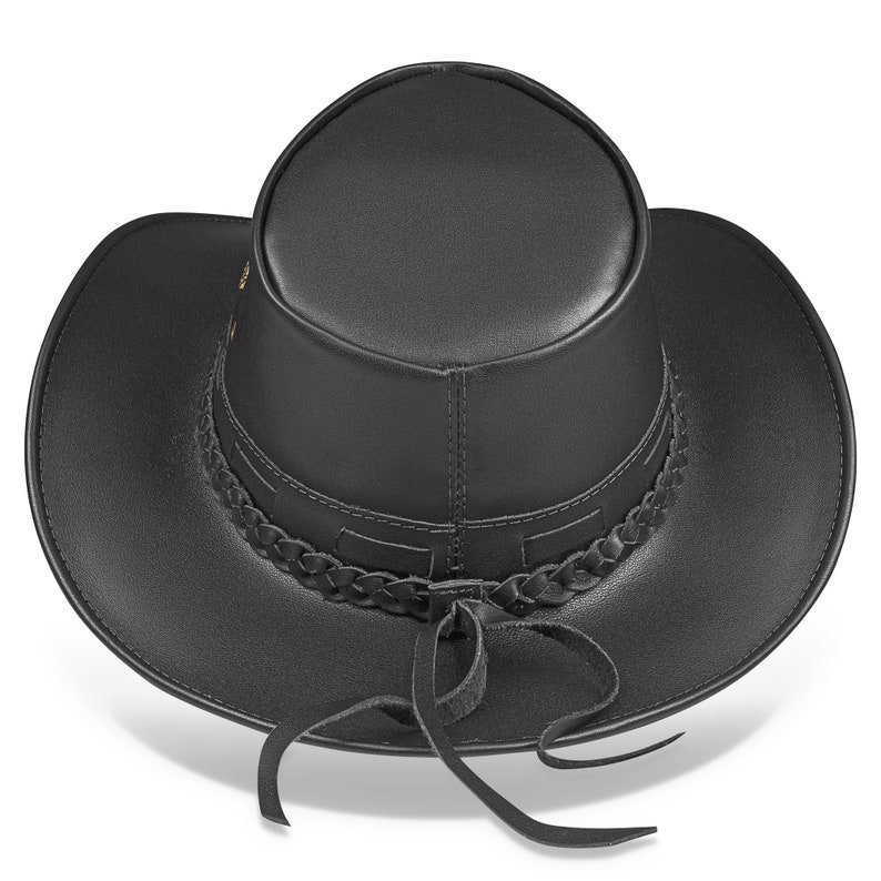 May include: A black leather cowboy hat with a braided band and a leather tie. The hat has a wide brim and a tall crown.