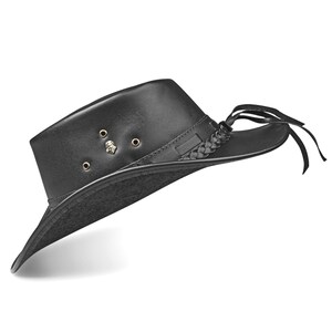 May include: A black leather cowboy hat with a braided band and a small metal skull design.