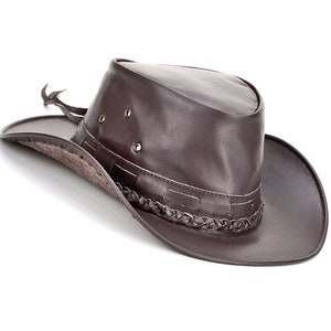 May include: A brown leather cowboy hat with a braided trim and a wide brim.