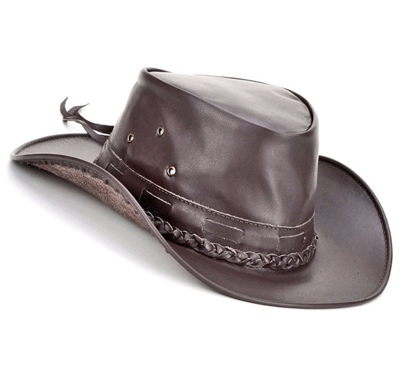 May include: A brown leather cowboy hat with a braided trim and a wide brim.
