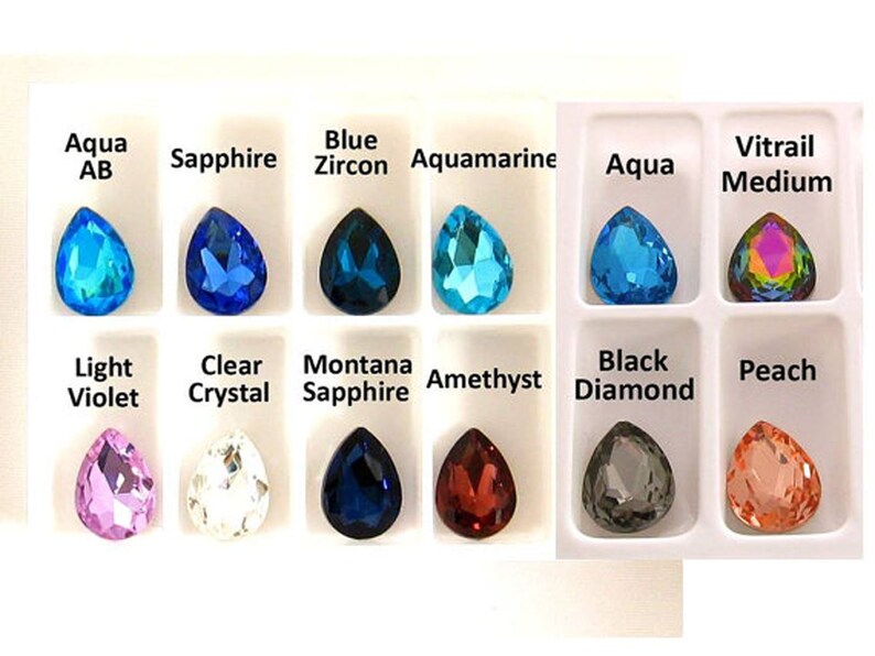 May include: Assortment of pearlescent teardrop-shaped glass beads in various colors, including aqua, sapphire, blue zircon, aquamarine, light violet, clear crystal, montana sapphire, amethyst, black diamond, and peach.