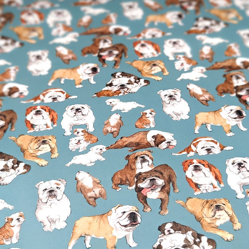 May include: A blue background with a repeating pattern of white, brown, and black bulldog illustrations. The bulldogs are in various poses, including sitting, standing, and lying down.