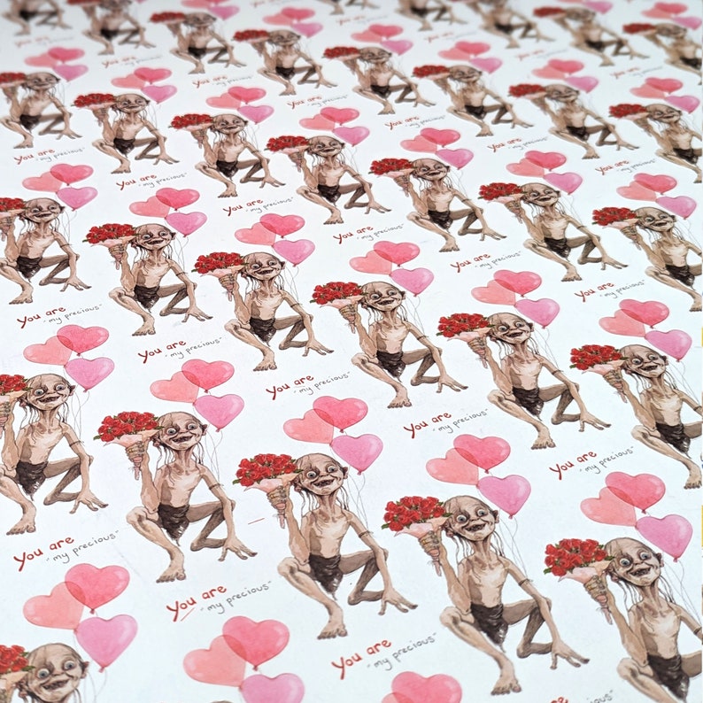 May include: Wrapping paper with a repeating pattern of a cartoon character holding flowers and heart-shaped balloons. The text "You are my precious" is printed in red on the white background.