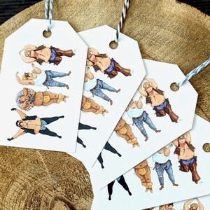 May include: Gift tags with illustrations of men in various outfits, including a cowboy, a Native American, and a biker. The tags are white with a hole at the top and are strung with twine. The background is a textured, brown surface.