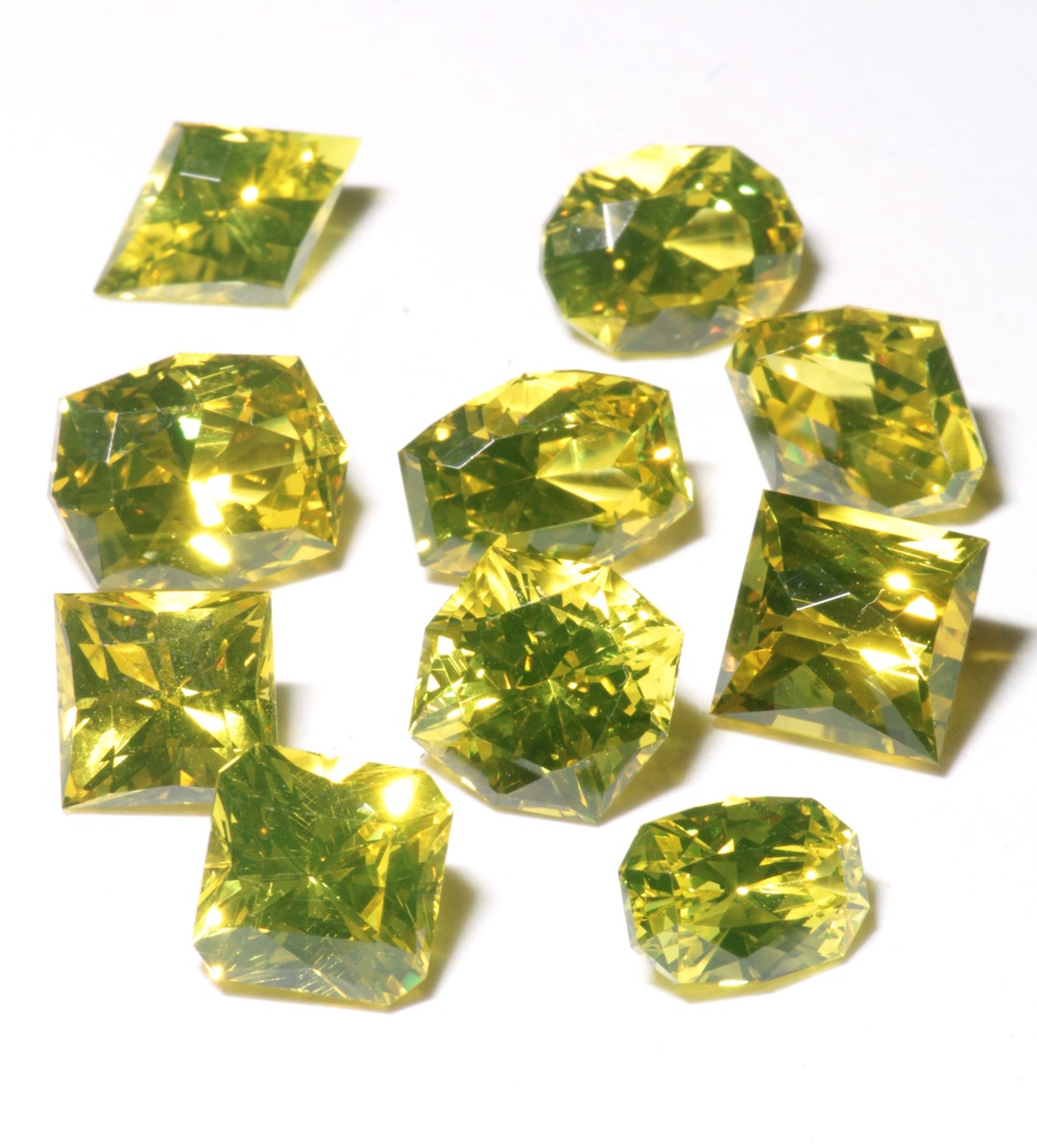 Golden Laser Gems, Lab Created Ce Nd YAG Crystal Faceted