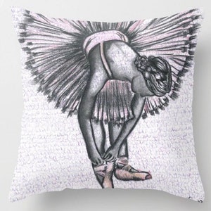 May include: A black and white drawing of a ballerina wearing a pink tutu, bending over to tie her ballet shoes. The background is a white surface with a faint pattern.