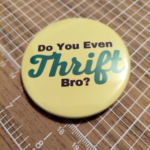 May include: A yellow button with the text "Do You Even Thrift Bro?" in brown and green lettering.