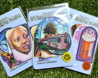May include: Three sticker packs with a blue background and the text "Mystery Sticker Pack". The sticker packs feature a variety of colorful designs, including a portrait of a person, a house with a tree, and a bottle with a cap.