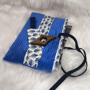 Paperback book cover, book sleeve, bookmark and reading ring