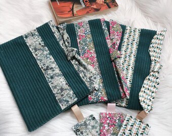 Paperback book cover, book sleeve, with bookmark and reading ring