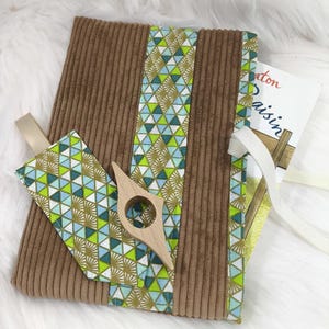 Paperback book cover, book sleeve, bookmark and reading ring