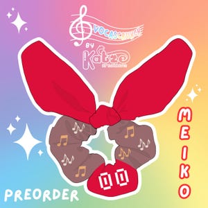 May include: A red and brown hair scrunchie with a bow and musical notes print. The scrunchie has the text "MEIKO" and "PREORDER" on it. The scrunchie is made by "VOCASCRUNCH by Katzo Kreations".