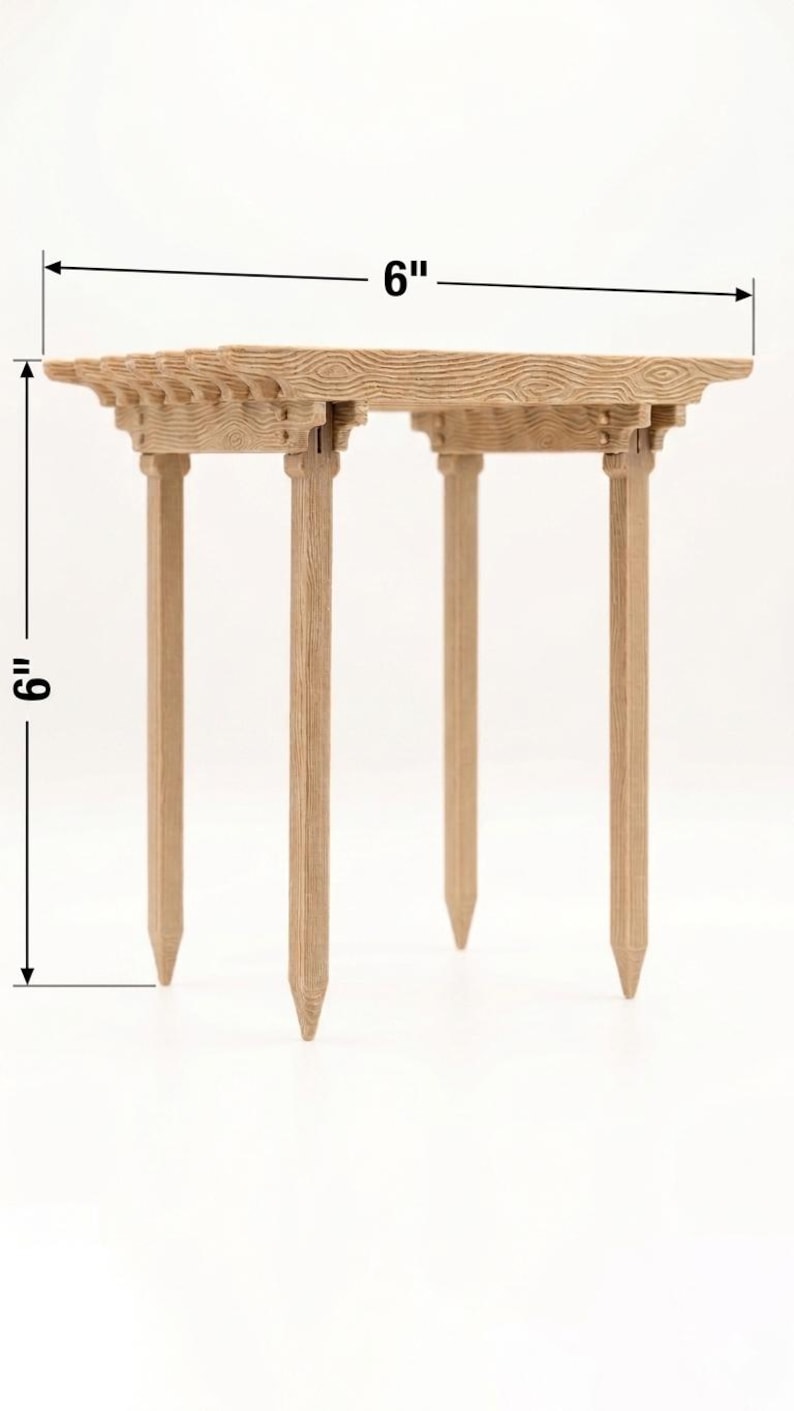 May include: A small, wooden table with a decorative top and four legs. The table is 6 inches wide and 6 inches tall. The wood has a natural, light brown color and a textured surface. The table is designed for decorative purposes.