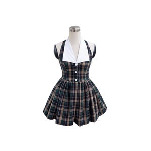 May include: A plaid dress with a white collar and buttons. The dress is sleeveless and has a fitted bodice and a full skirt.