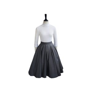 May include: A gray full circle skirt with a high waistline. The skirt is made of a smooth, structured fabric and has a classic, vintage style.