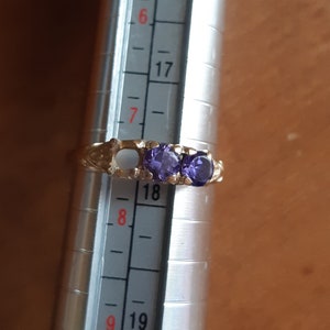 For repair, missing stone. 10k gold ring with high quality tanzanite stones