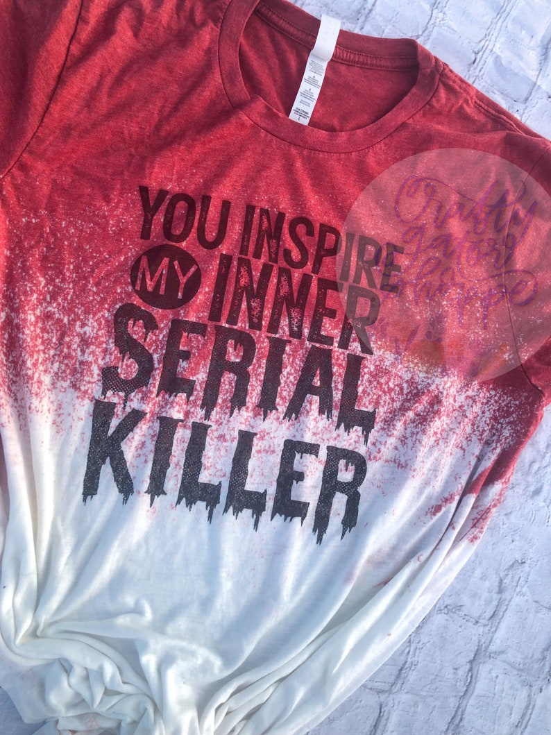 May include: Red and white bleached t-shirt with black text that reads "You inspire my inner serial killer".