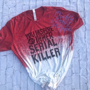 May include: Red and white bleached t-shirt with the text "You inspire my inner serial killer" and "Crafty & Scary Happy" in purple.