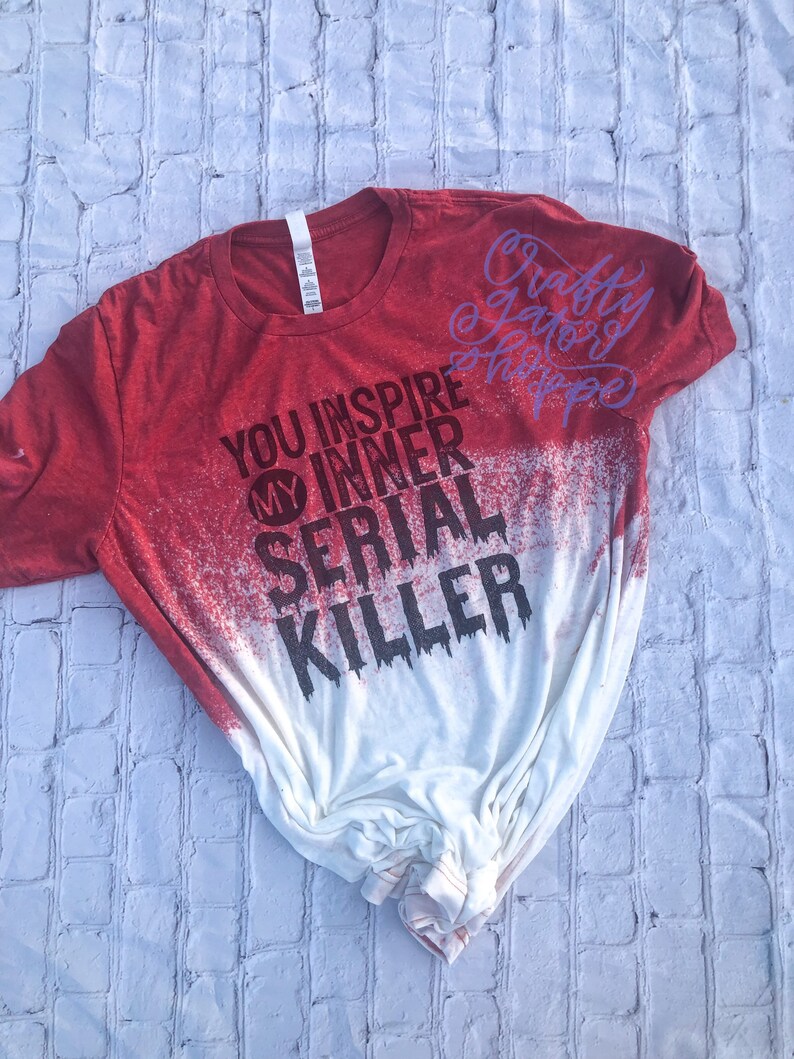 May include: Red and white bleached t-shirt with the text "You inspire my inner serial killer" and "Crafty & Scary Happy" in purple.