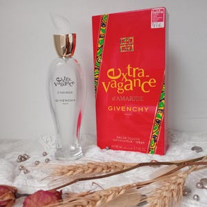 Empty bottle and box of GIVENCHY EXTRAVAGANCE by Amarige, vintage collectible perfume.