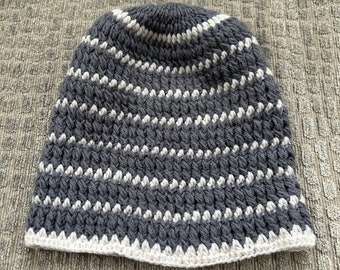 Gray and white kufi-style crocheted hat