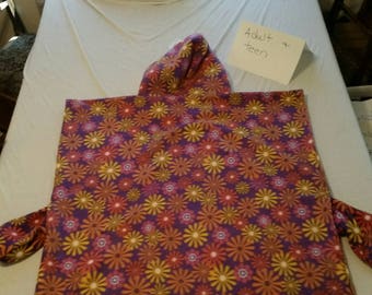 Pink/purple/yellow floral poncho with closed sides and pockets