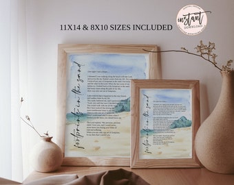 May include: Two framed prints of a watercolor painting of a beach scene with the text "Footprints in the Sand" and a poem about faith. The prints are in wooden frames and are displayed on a wooden surface.