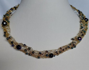 Gold wire necklace crocheted with glass beads