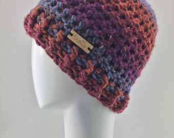 Crochet orange purple and blue messy bun or ponytail hat